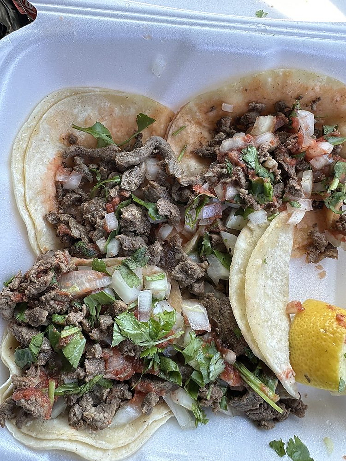 Carne asada street tacos in a takeout box
