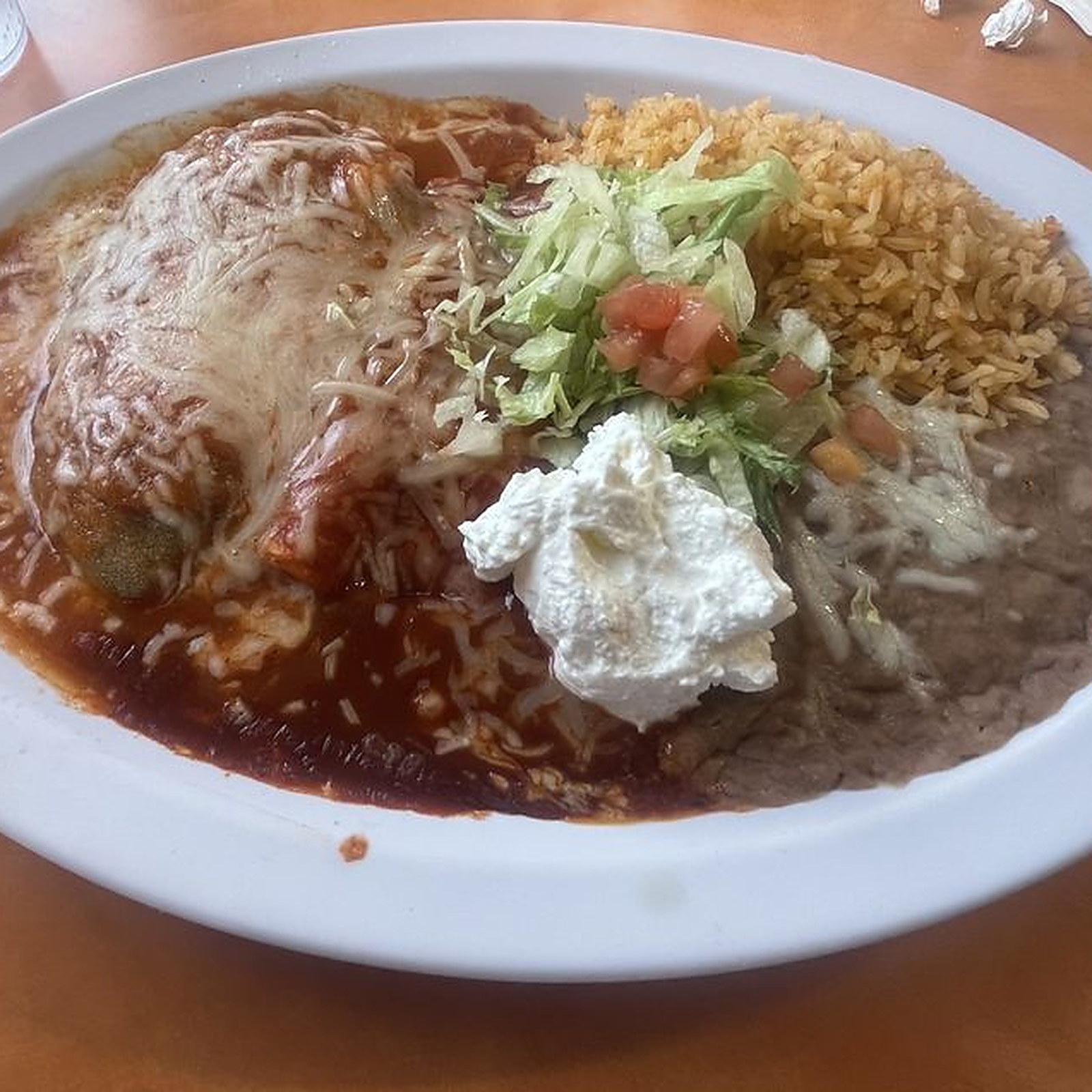 CHILE RELLENO &mdash; Roasted chile, melted cheese, red sauce