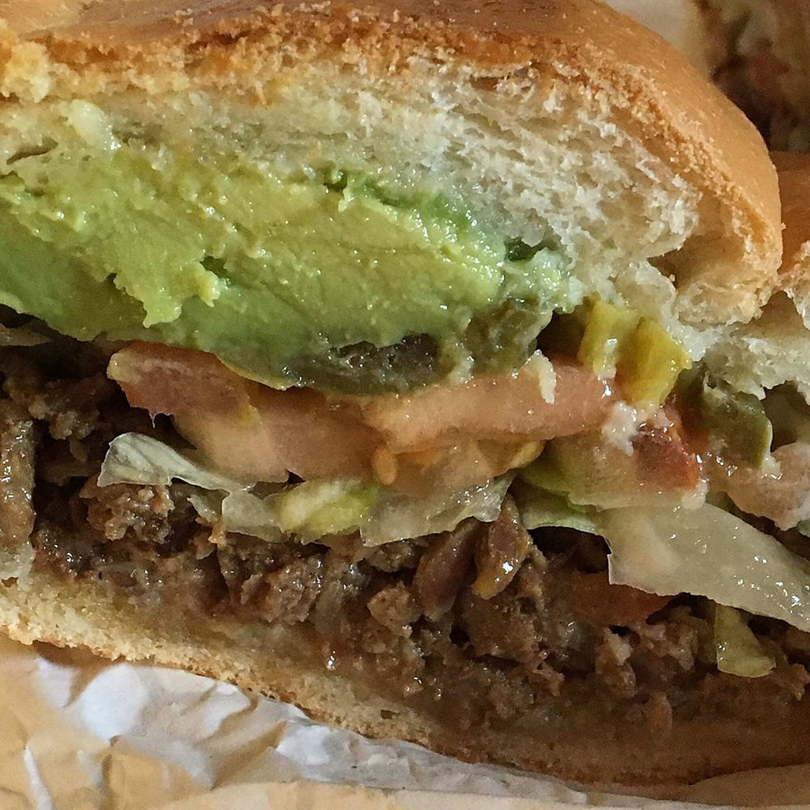 TORTA &mdash; Grilled meat and avocado in a soft roll